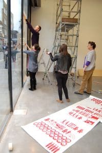 Putting up the Vinyl artwork - iniva at Rivington Place